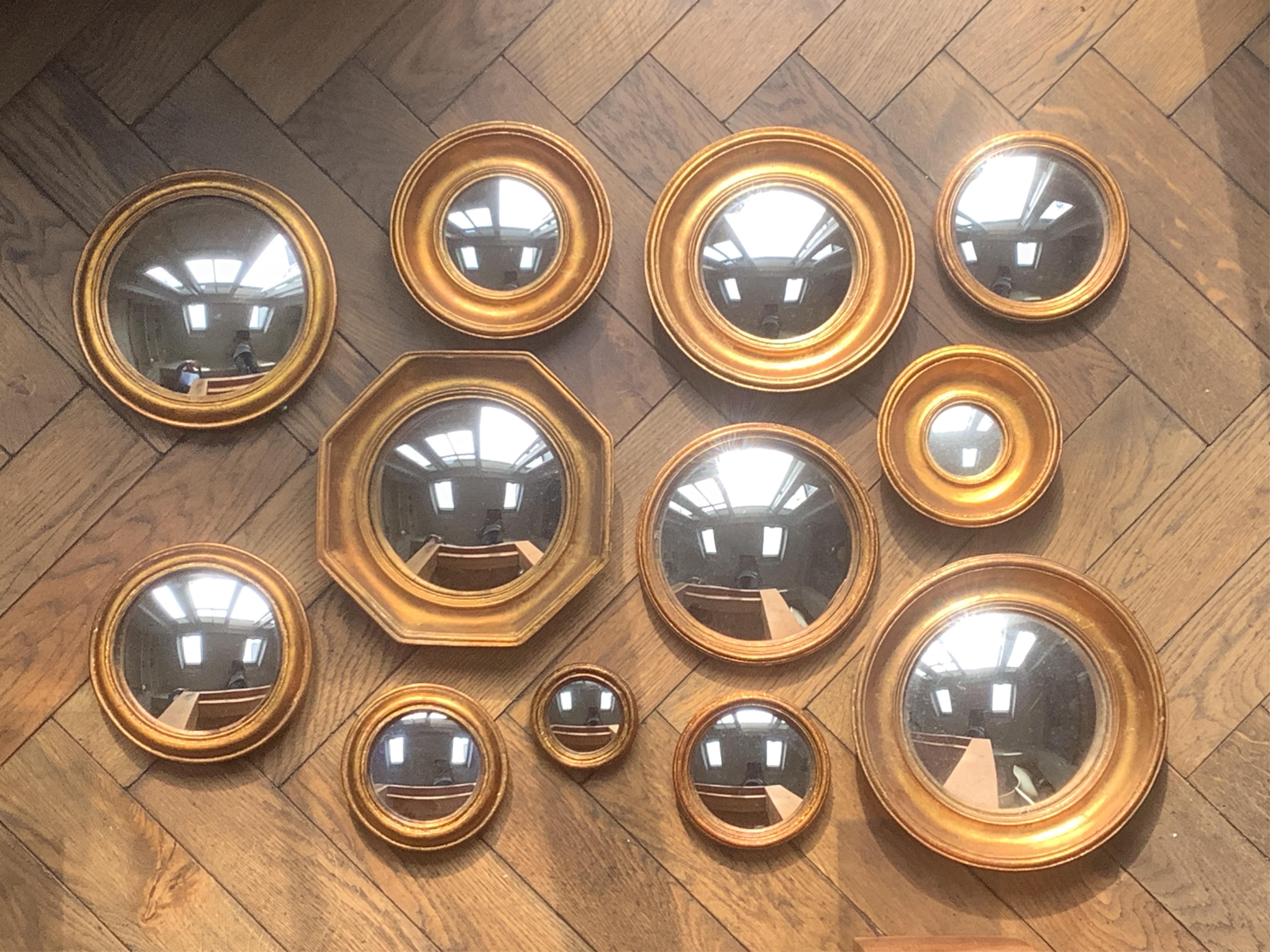 A group of twelve small gilt frame convex wall mirrors, largest 26cm diameter. Condition - good, some light scratches to frames